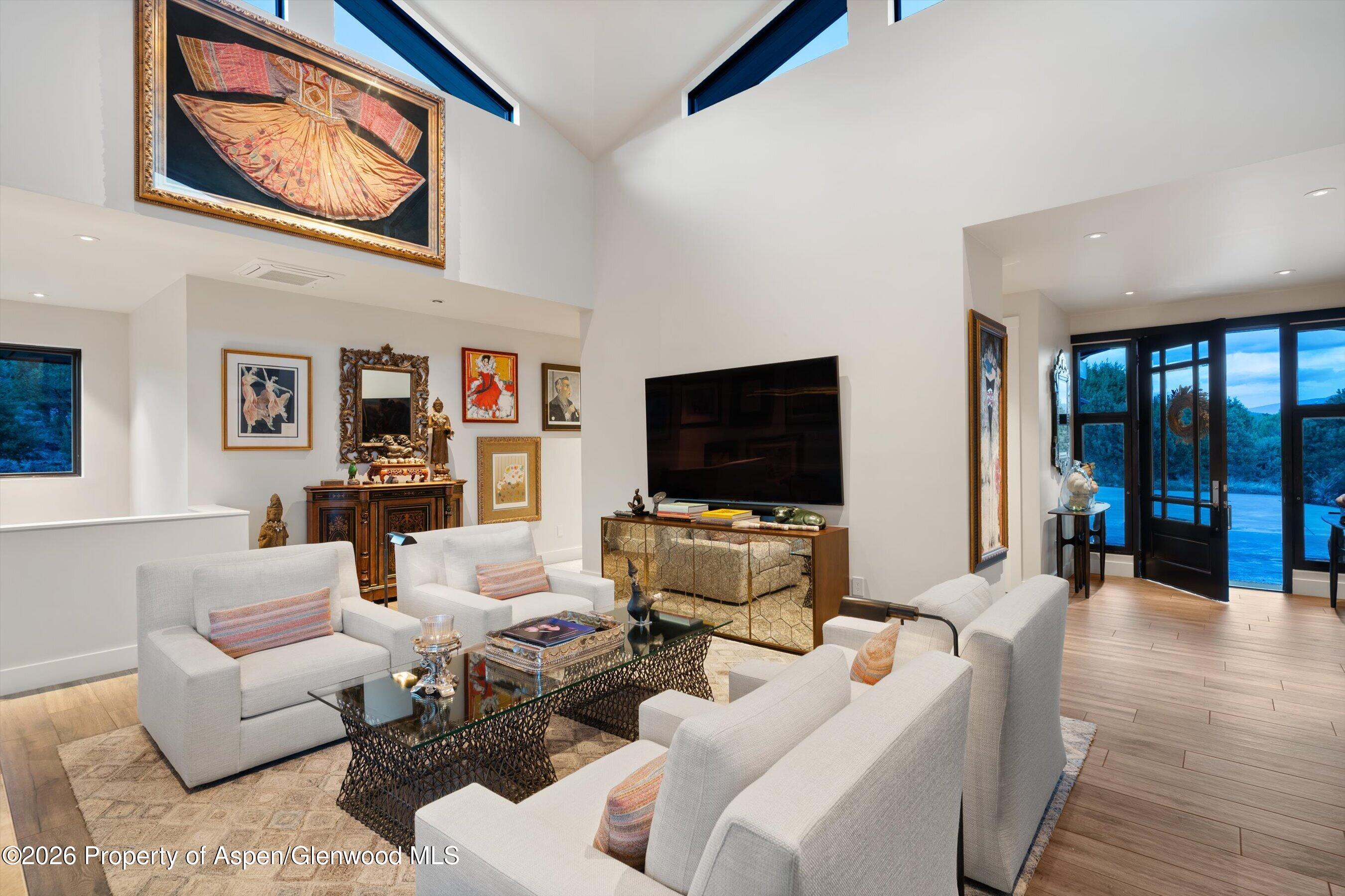 258 Monarch Road Glenwood Springs, CO 81601 - Photo 9 of 73 a living room with furniture and a flat screen tv