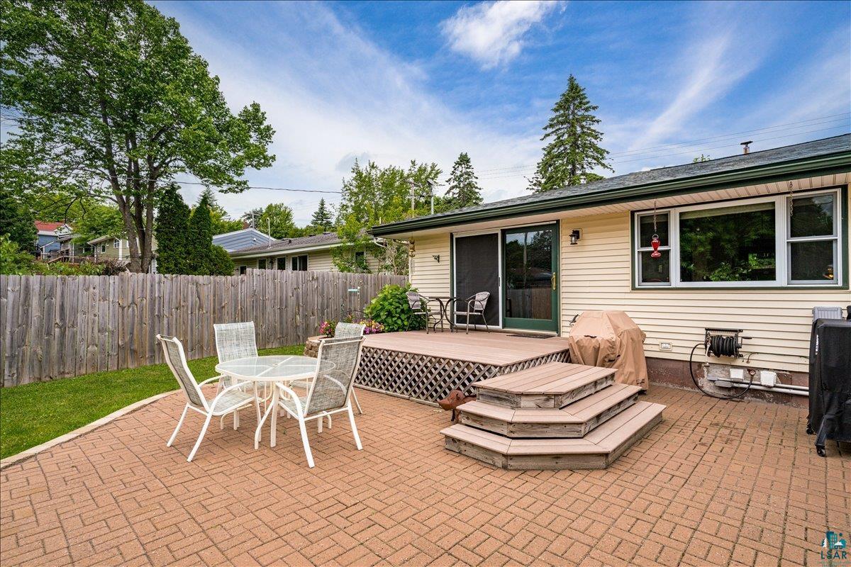 130 West Austin Street Duluth, MN 55803 - Photo 25 of 35 Expansive paver patio with a tiered wooden deck