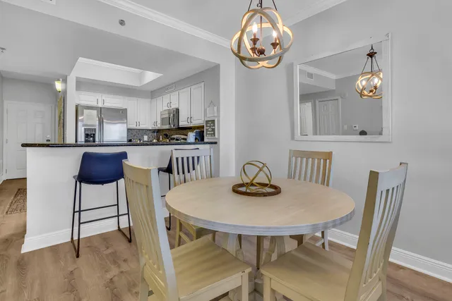 a view of a dining room with furniture and window