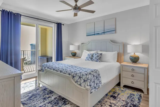 a bathroom with a granite countertop sink a mirror and shower