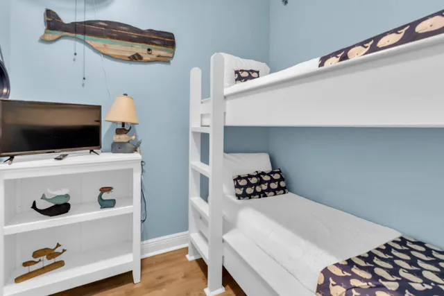 a kitchen with stainless steel appliances kitchen island a stove a refrigerator and a fireplace