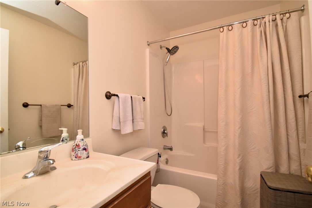 23825 Rockside Road Bedford, OH 44146 - Photo 17 of 22 Full bathroom with shower / tub combo with curtain, vanity, and toilet