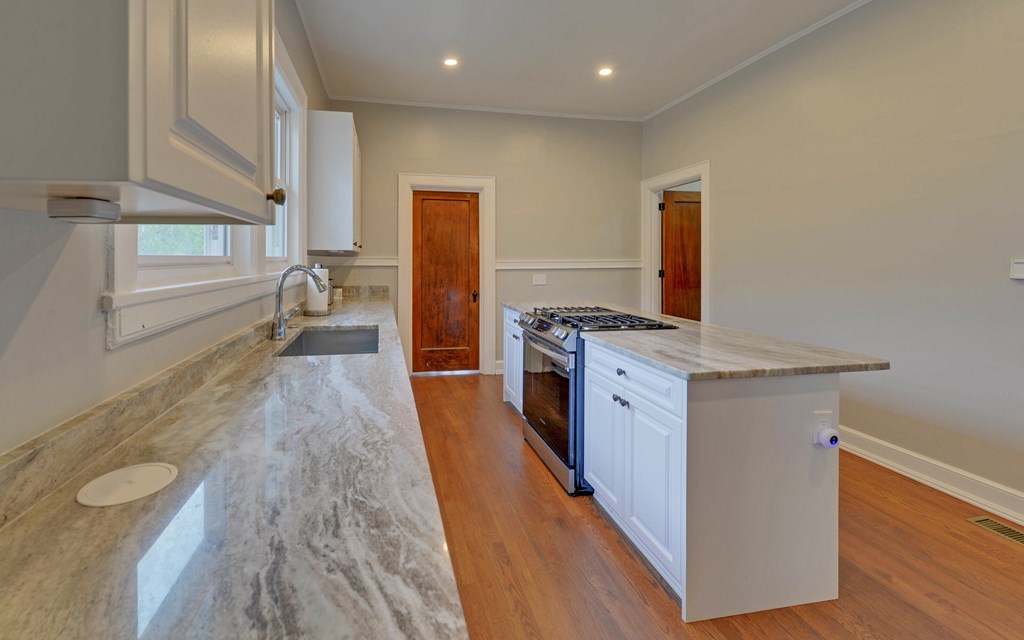 2465 Blue Ridge Drive Blue Ridge, GA 30513 - Photo 15 of 60 a kitchen with stainless steel appliances granite countertop a stove and a refrigerator