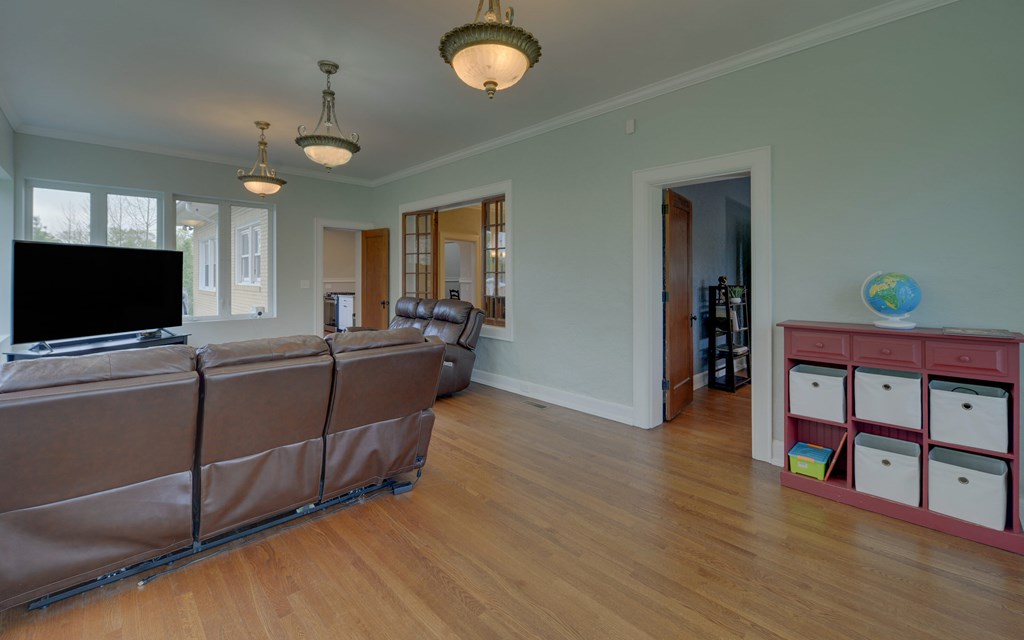 2465 Blue Ridge Drive Blue Ridge, GA 30513 - Photo 23 of 60 a living room with furniture and a flat screen tv