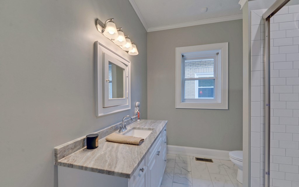 2465 Blue Ridge Drive Blue Ridge, GA 30513 - Photo 38 of 60 a bathroom with a sink and a mirror