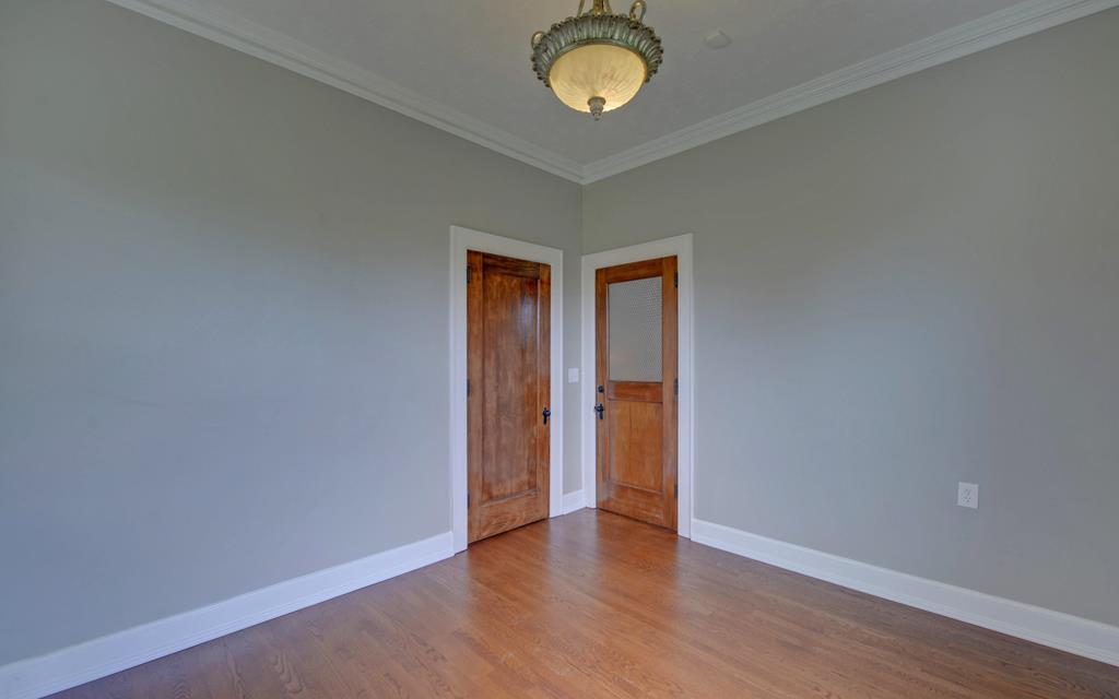 2465 Blue Ridge Drive Blue Ridge, GA 30513 - Photo 42 of 60 a view of an empty room with a window and wooden floor
