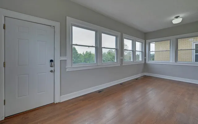 a view of a house with a backyard