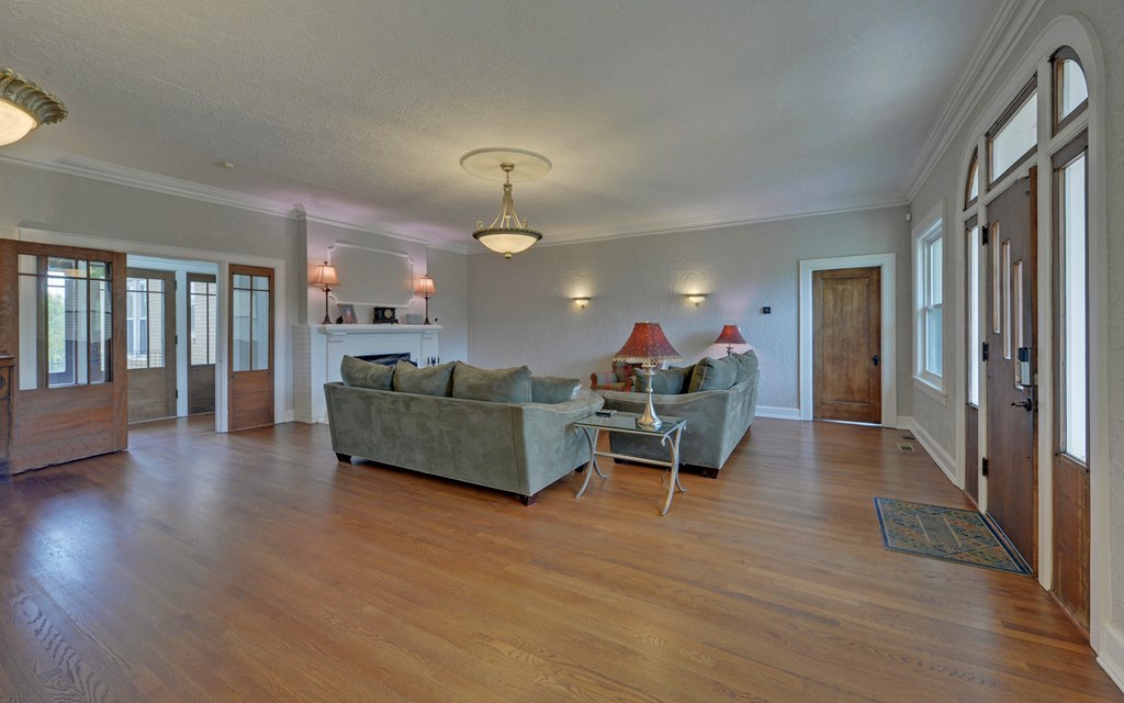 2465 Blue Ridge Drive Blue Ridge, GA 30513 - Photo 7 of 60 a living room with furniture and a wooden floor