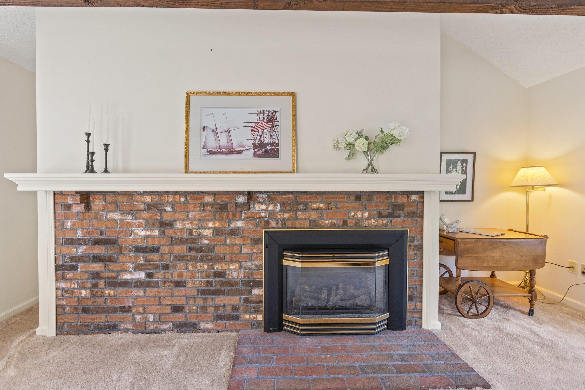 22 Debs Hill Road, Unit 6A Yarmouth Port, MA 02675 - Photo 12 of 30 a living room with a fireplace