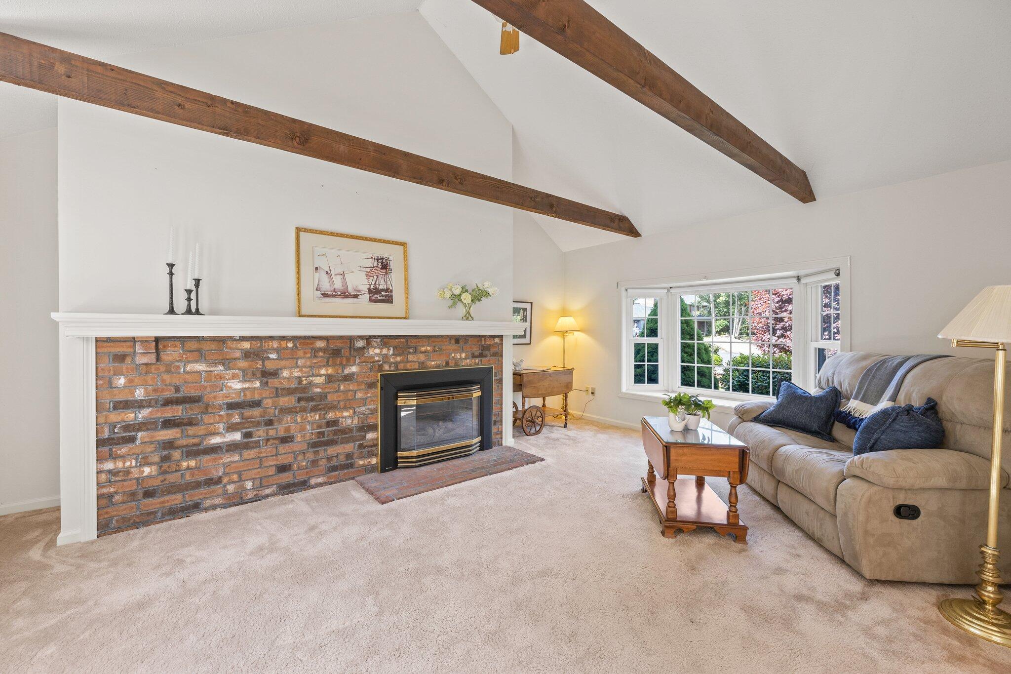 22 Debs Hill Road, Unit 6A Yarmouth Port, MA 02675 - Photo 13 of 30 a living room with furniture and a fireplace