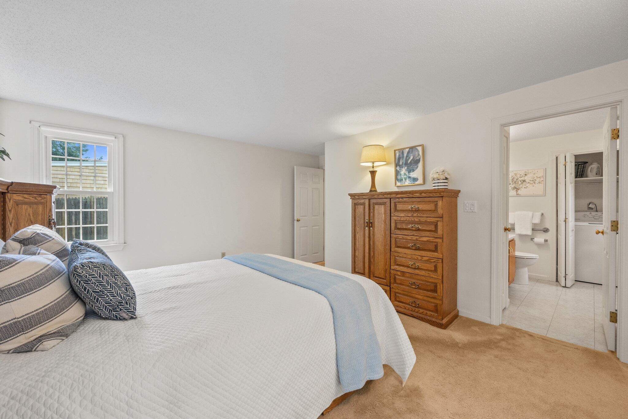 22 Debs Hill Road, Unit 6A Yarmouth Port, MA 02675 - Photo 15 of 30 a bedroom with a bed and dresser
