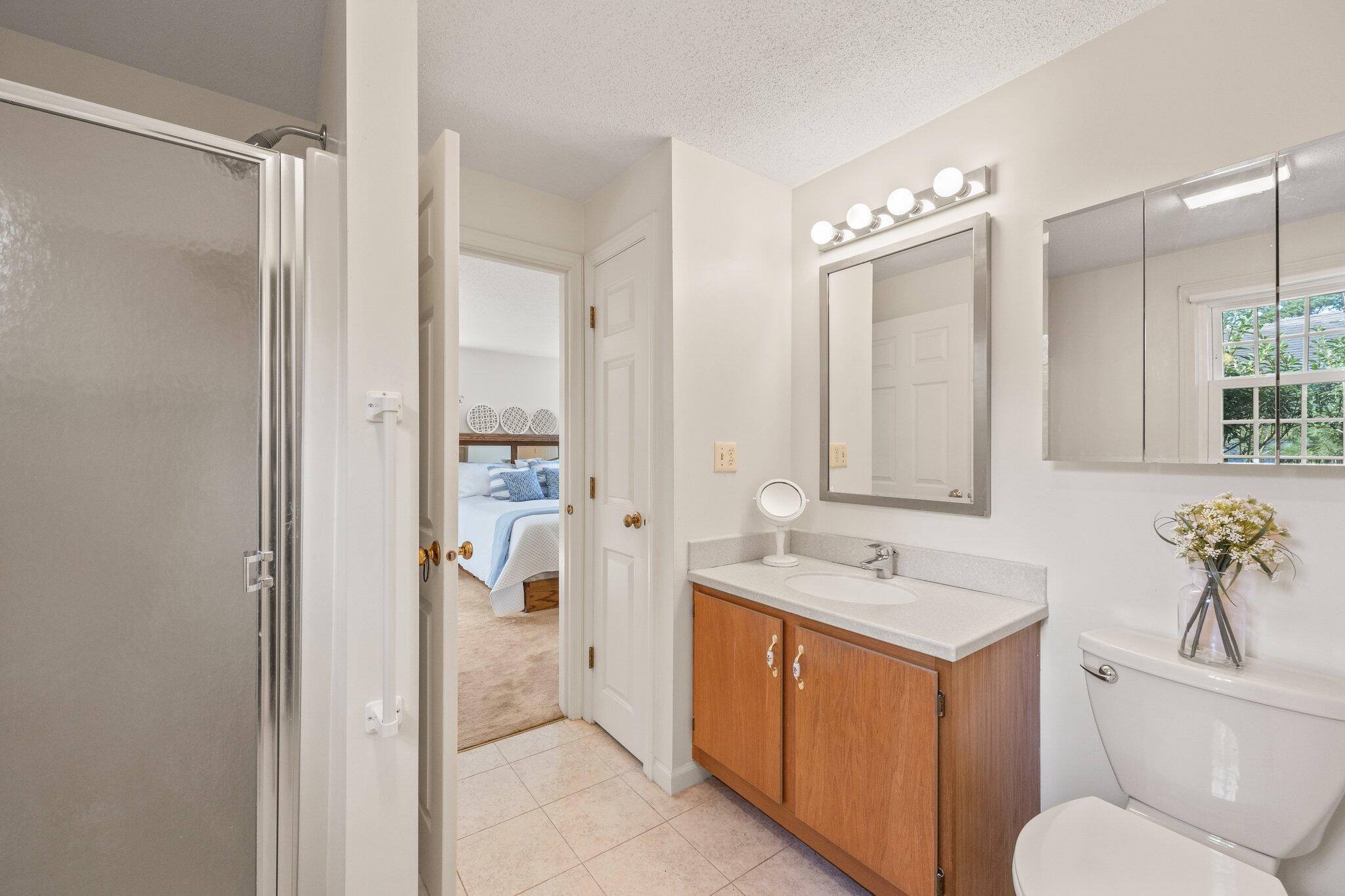 22 Debs Hill Road, Unit 6A Yarmouth Port, MA 02675 - Photo 16 of 30 a bathroom with a toilet sink and mirror