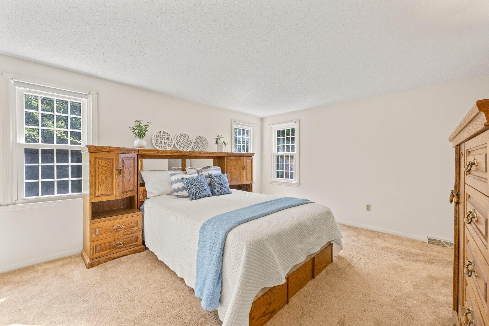 22 Debs Hill Road, Unit 6A Yarmouth Port, MA 02675 - Photo 18 of 30 a bedroom with a large bed and a window