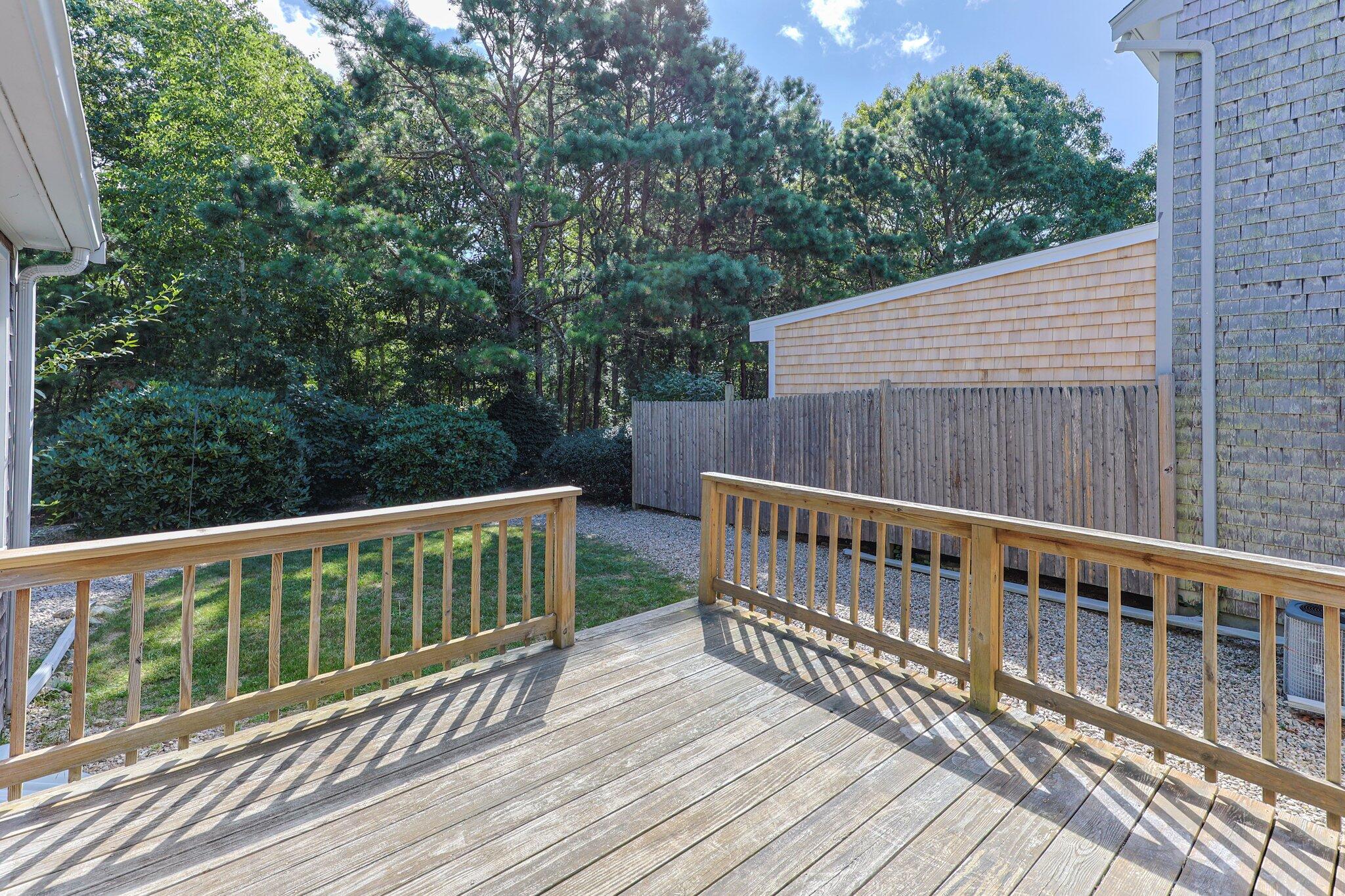 22 Debs Hill Road, Unit 6A Yarmouth Port, MA 02675 - Photo 23 of 30 a view of balcony with wooden floor and fence
