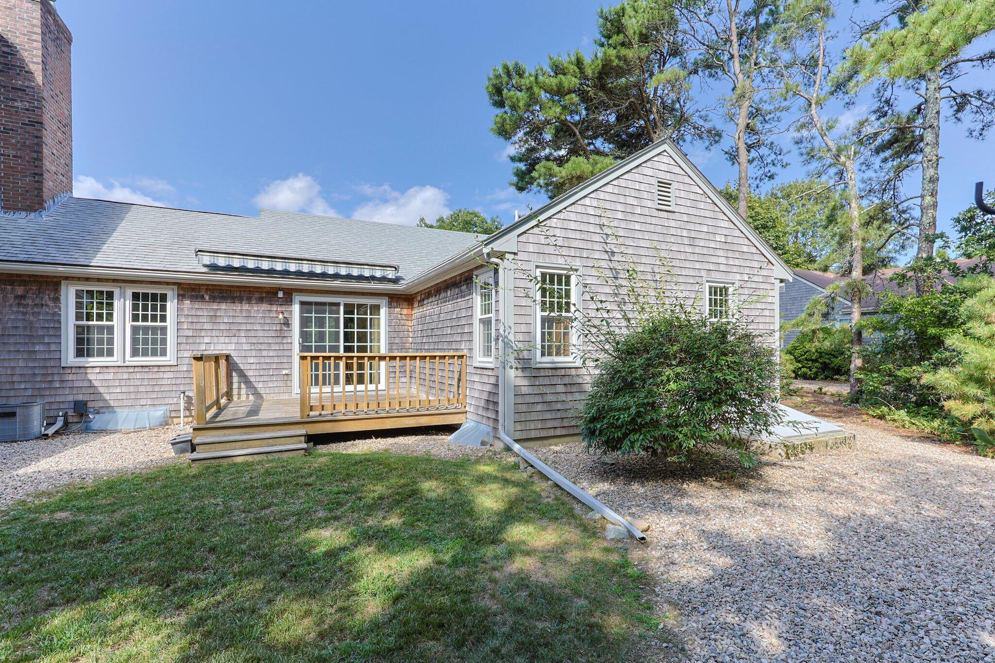 22 Debs Hill Road, Unit 6A Yarmouth Port, MA 02675 - Photo 25 of 30 a house view with a garden space