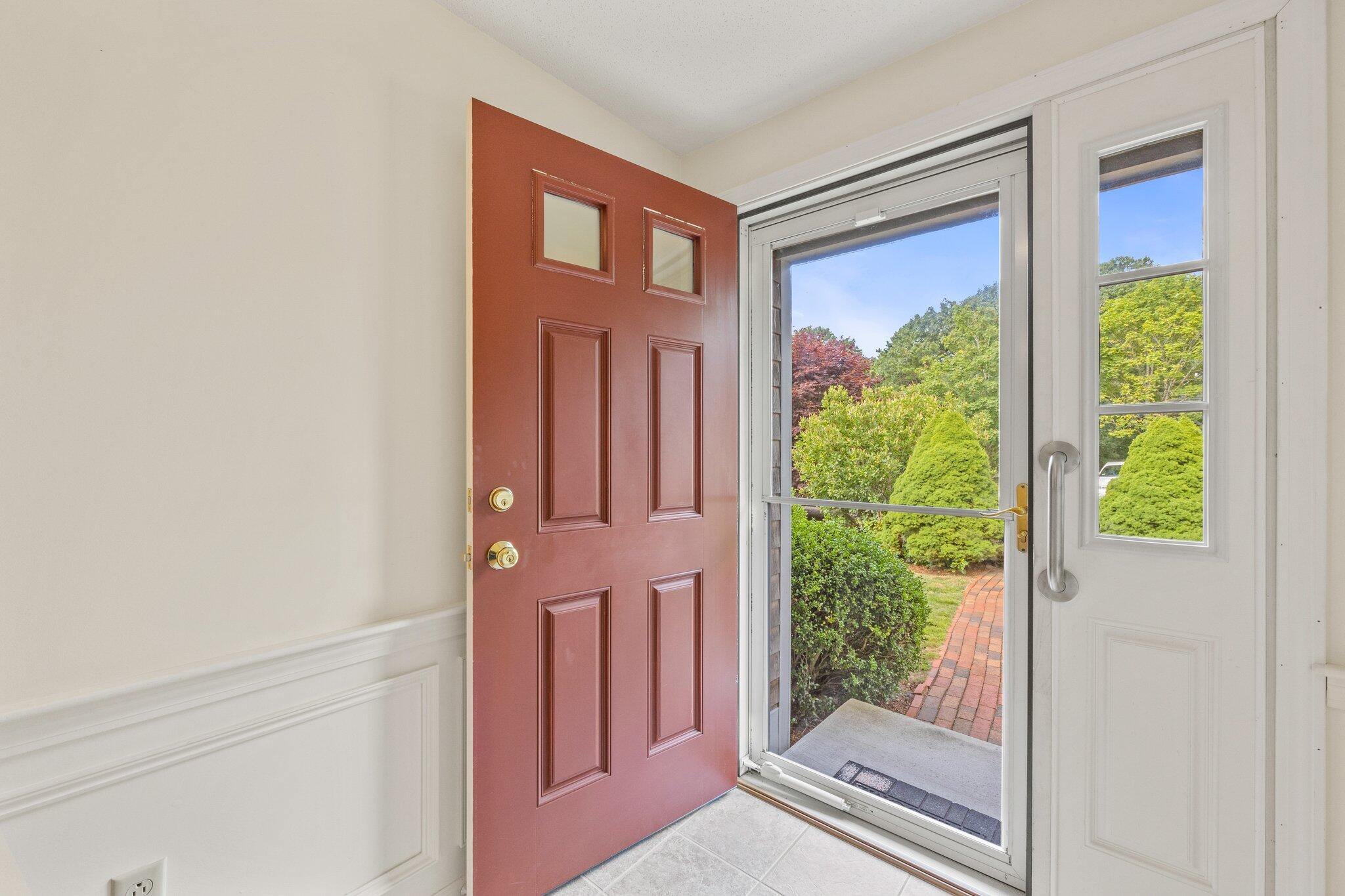 22 Debs Hill Road, Unit 6A Yarmouth Port, MA 02675 - Photo 3 of 30 a view of a door and chair in a room