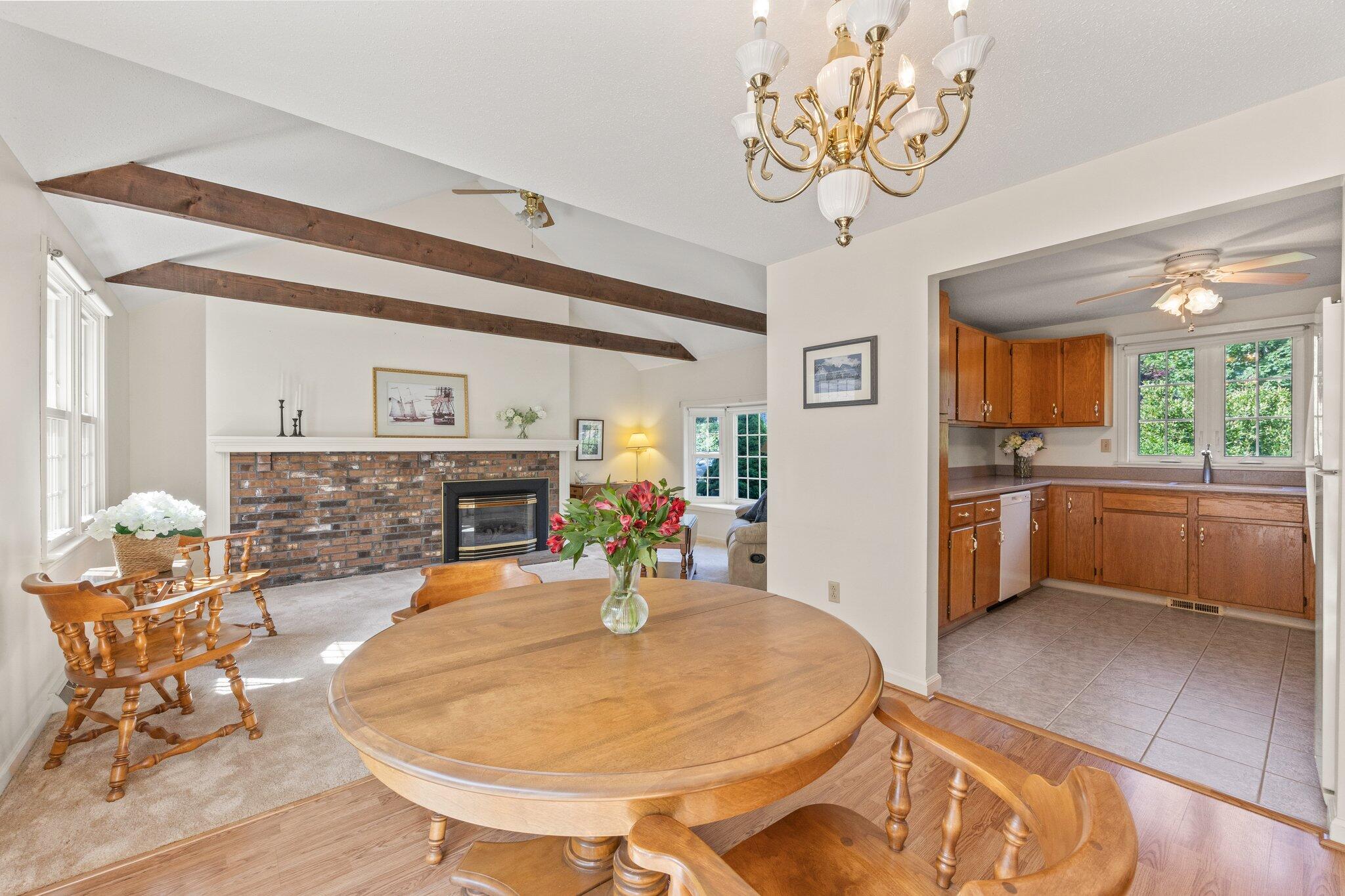 22 Debs Hill Road, Unit 6A Yarmouth Port, MA 02675 - Photo 9 of 30 a view of a dining room with furniture and a chandelier