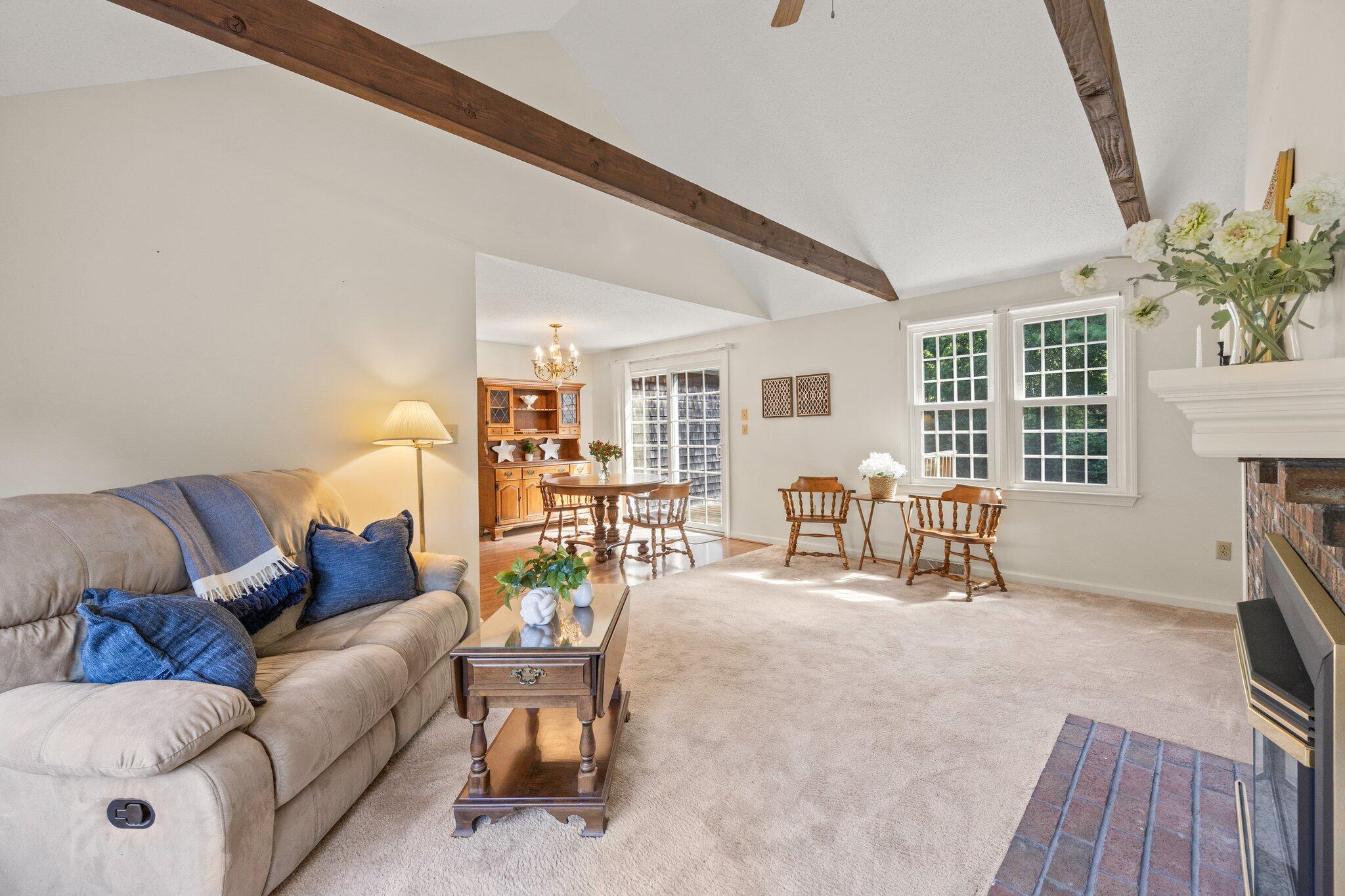 22 Debs Hill Road, Unit 6A Yarmouth Port, MA 02675 - Photo 10 of 30 a living room with furniture and a fireplace