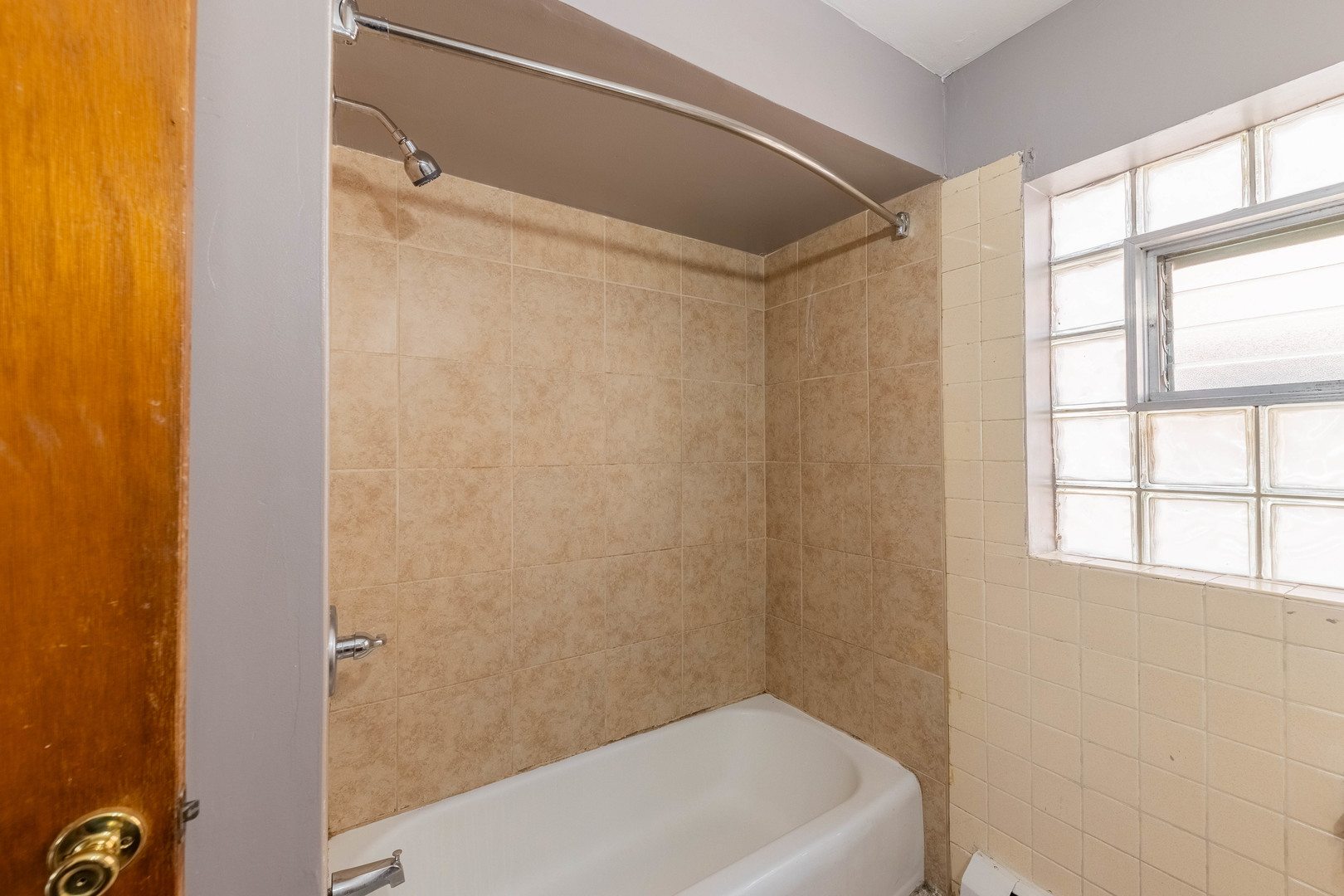 4634 West 47th Street, Unit 1 Chicago, IL 60632 - Photo 11 of 18 a bathroom with a tub and a shower