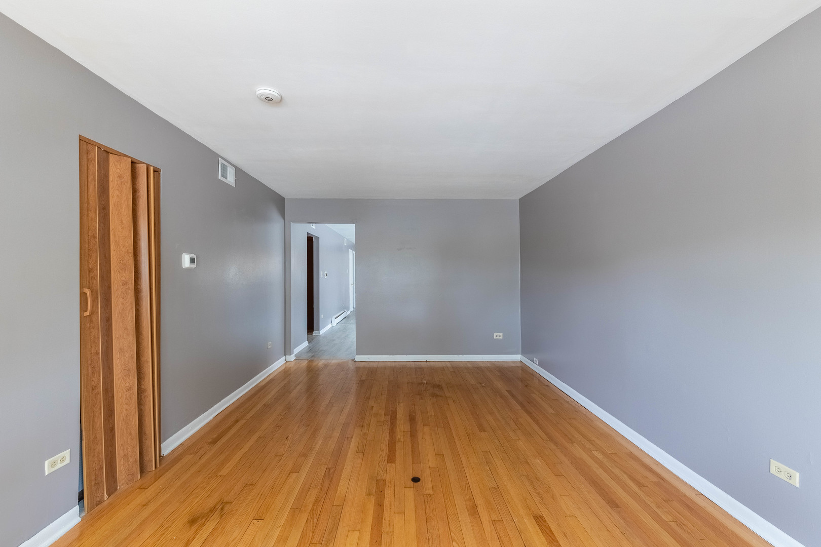 4634 West 47th Street, Unit 1 Chicago, IL 60632 - Photo 4 of 18 a view of a big room with wooden floor and brick walls