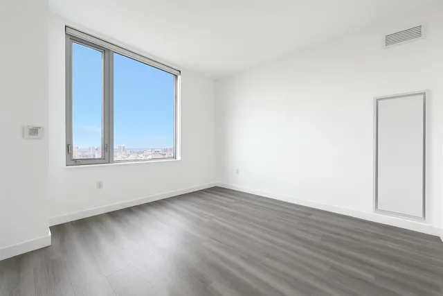 a view of kitchen with furniture and wooden floor