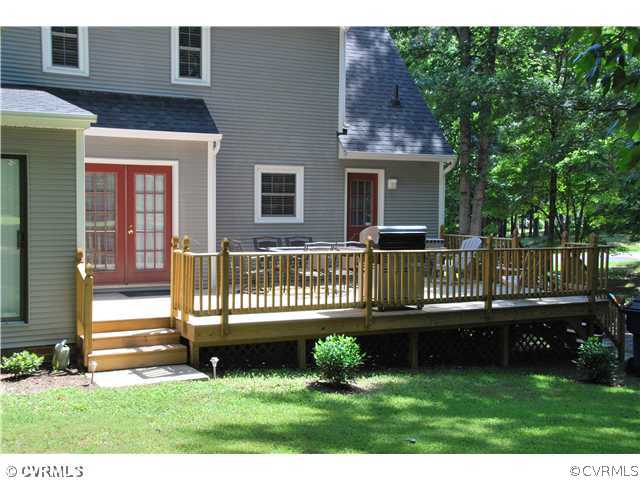 4733 Crossgate Road Chester, VA 23831 - Photo 8 of 9 a front view of a house with a garden