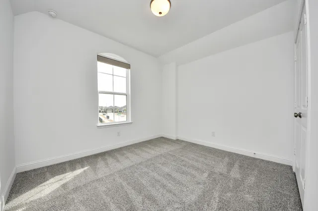 an empty room with a natural light