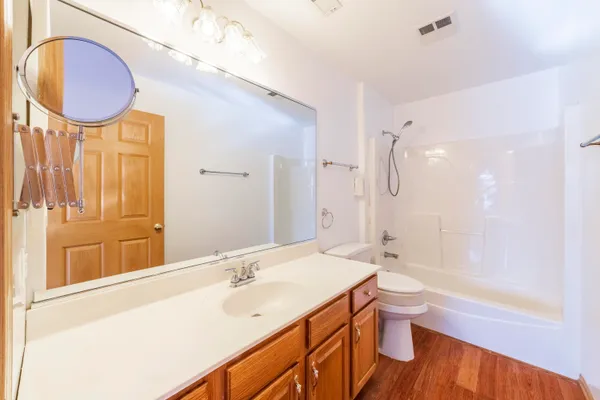 a bathroom with a sink a toilet and bathtub