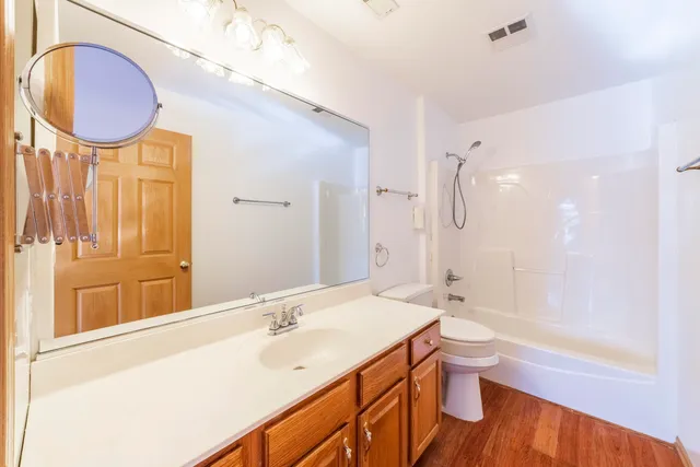 a bathroom with a sink a toilet and bathtub