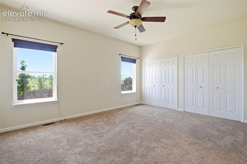 7806 Dutch Loop Colorado Springs, CO 80925 - Photo 14 of 41 a view of an empty room with a window