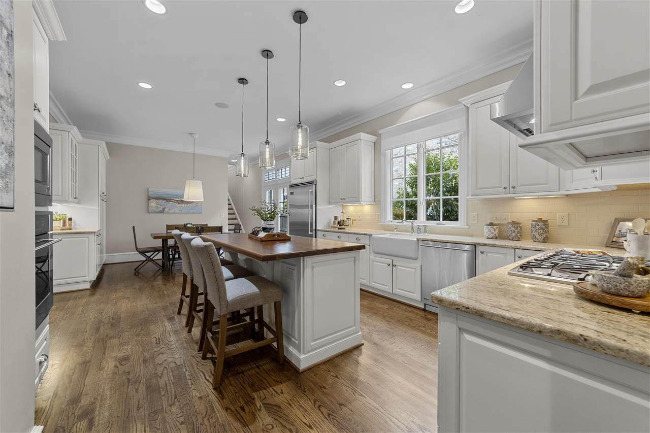 503 Guilford Circle Raleigh, NC 27608 - Photo 7 of 28 A real entertainer's kitchen with high ceilings, an island, a breakfast nook and plenty of storage. Kitchen