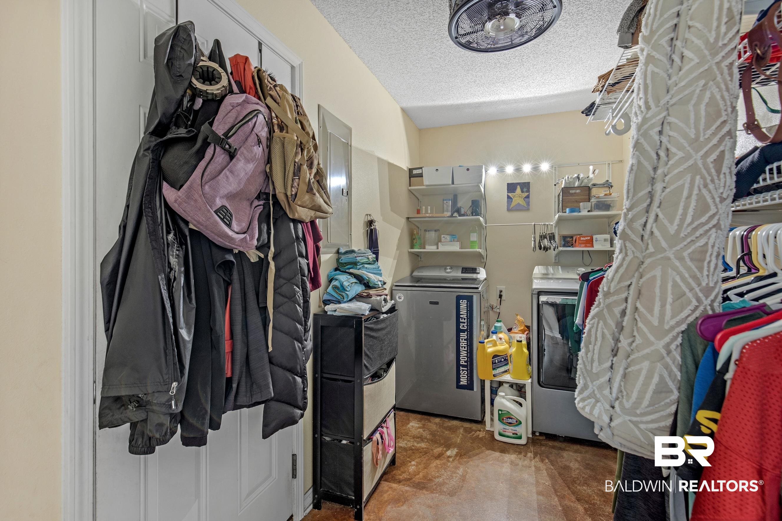 36087 Byrd Road Stapleton, AL 36578 - Photo 20 of 27 Walk in closet with carpet flooring and washing machine and clothes dryer