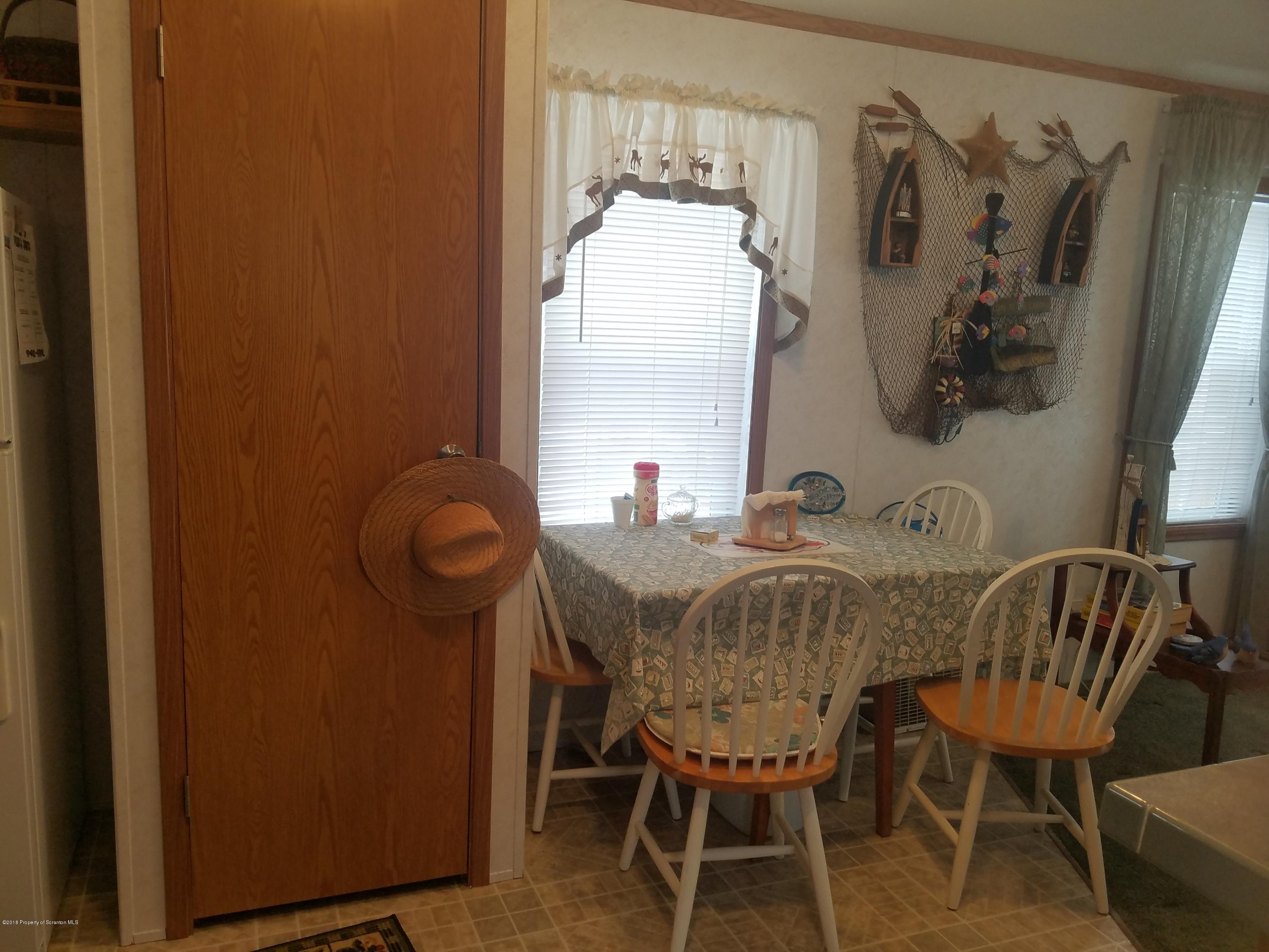 Lakeside Road Hop Bottom, PA 18824 - Photo 3 of 19 a view of a dining room with furniture and a window