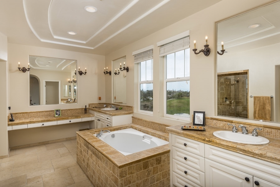 1356 Ranch Road Encinitas, CA 92024 - Photo 17 of 25 Luxurious master bath with a deep soaking tub, walk-in shower, and expansive counter space.