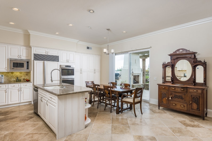 1356 Ranch Road Encinitas, CA 92024 - Photo 9 of 25 Entertaining is a dream offering well-flowing space from the expansive, chef-ready kitchen & family room area onto the custom-tiled patio.