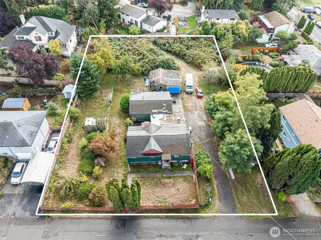 an aerial view of houses with outdoor space