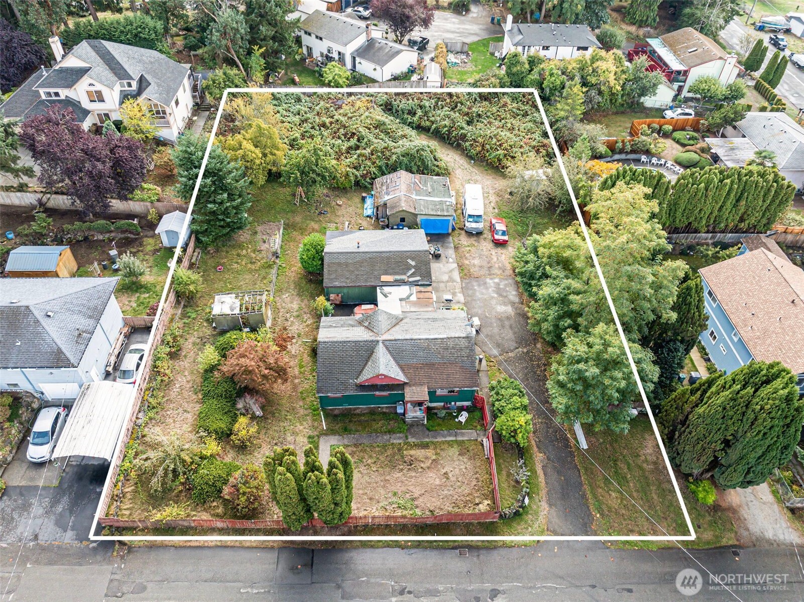 an aerial view of houses with outdoor space