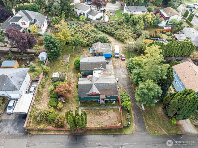 an aerial view of a houses with yard