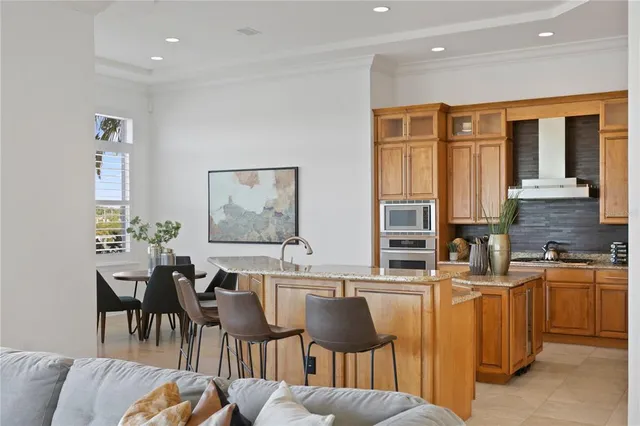a view of a dining room with furniture and a window