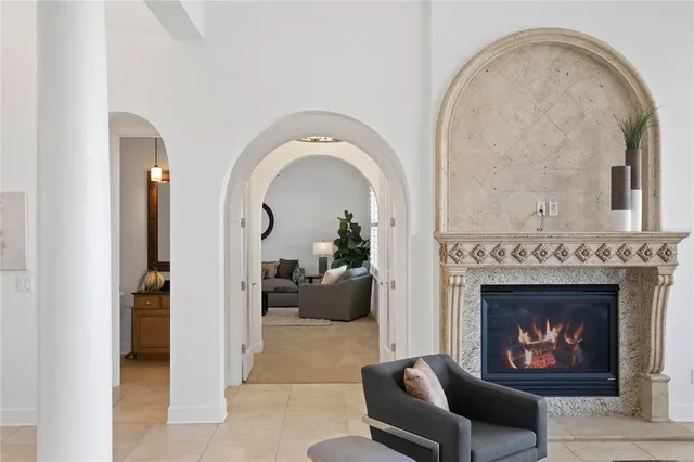 a bathroom with a granite countertop toilet sink and mirror