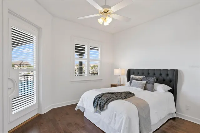 a bathroom with a granite countertop sink a toilet and shower