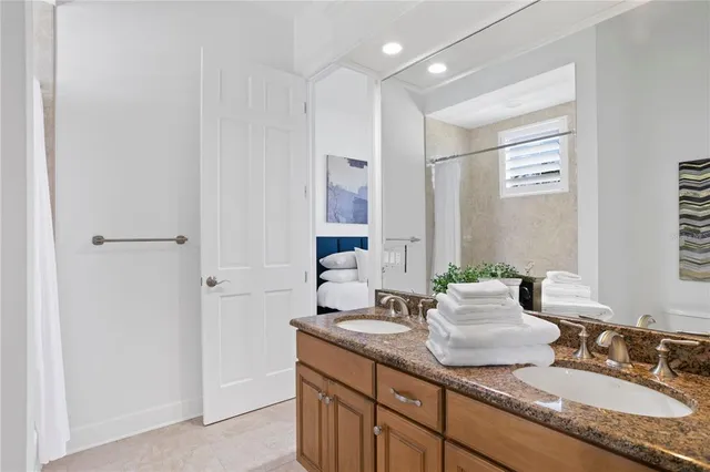 a view of a room with a table and chairs