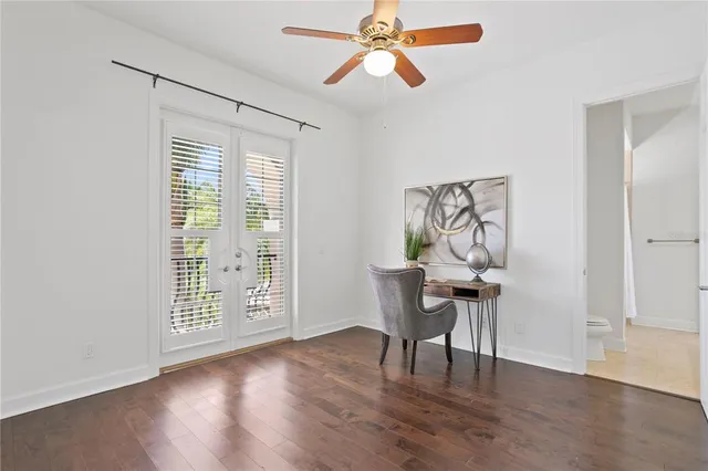 a view of water with boats and trees in the background