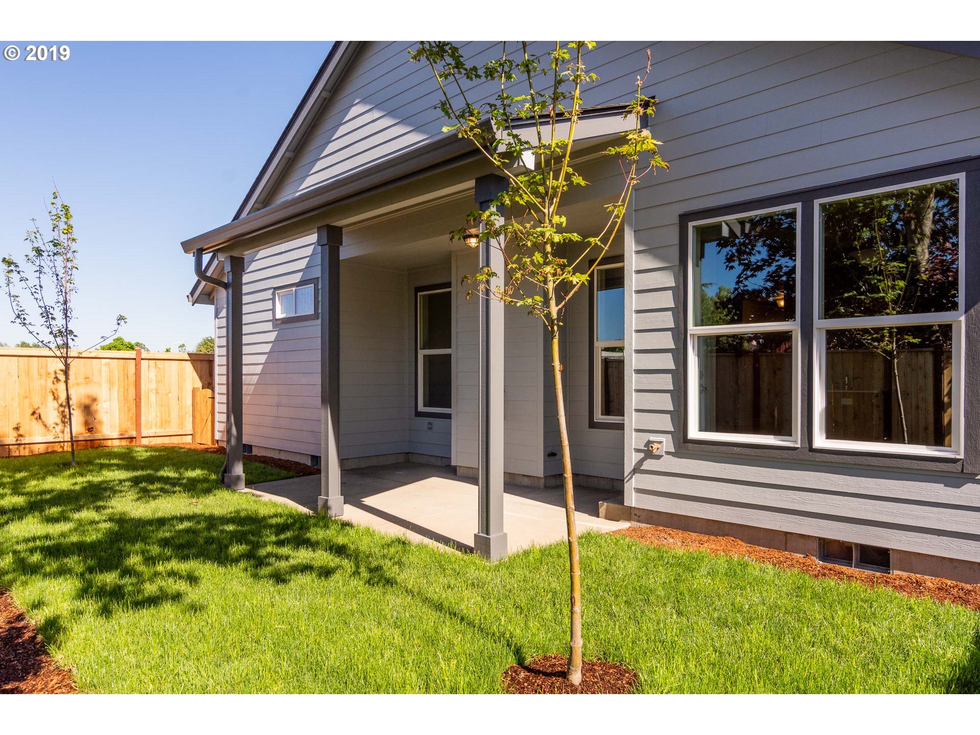 1068 West Olympic Street Springfield, OR 97477 - Photo 15 of 30 a backyard of a house with table and chairs