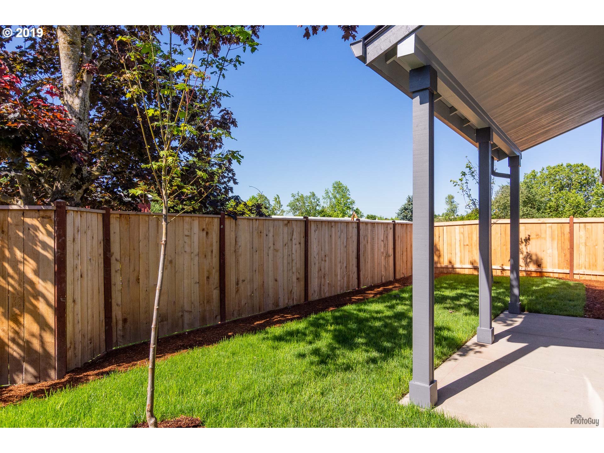 1068 West Olympic Street Springfield, OR 97477 - Photo 16 of 30 a view of a backyard with a garden