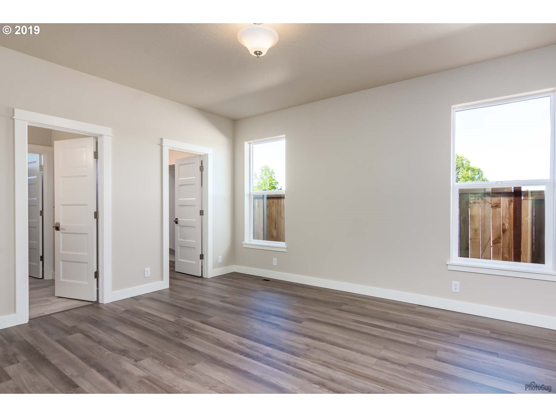 1068 West Olympic Street Springfield, OR 97477 - Photo 19 of 30 wooden floor in an empty room