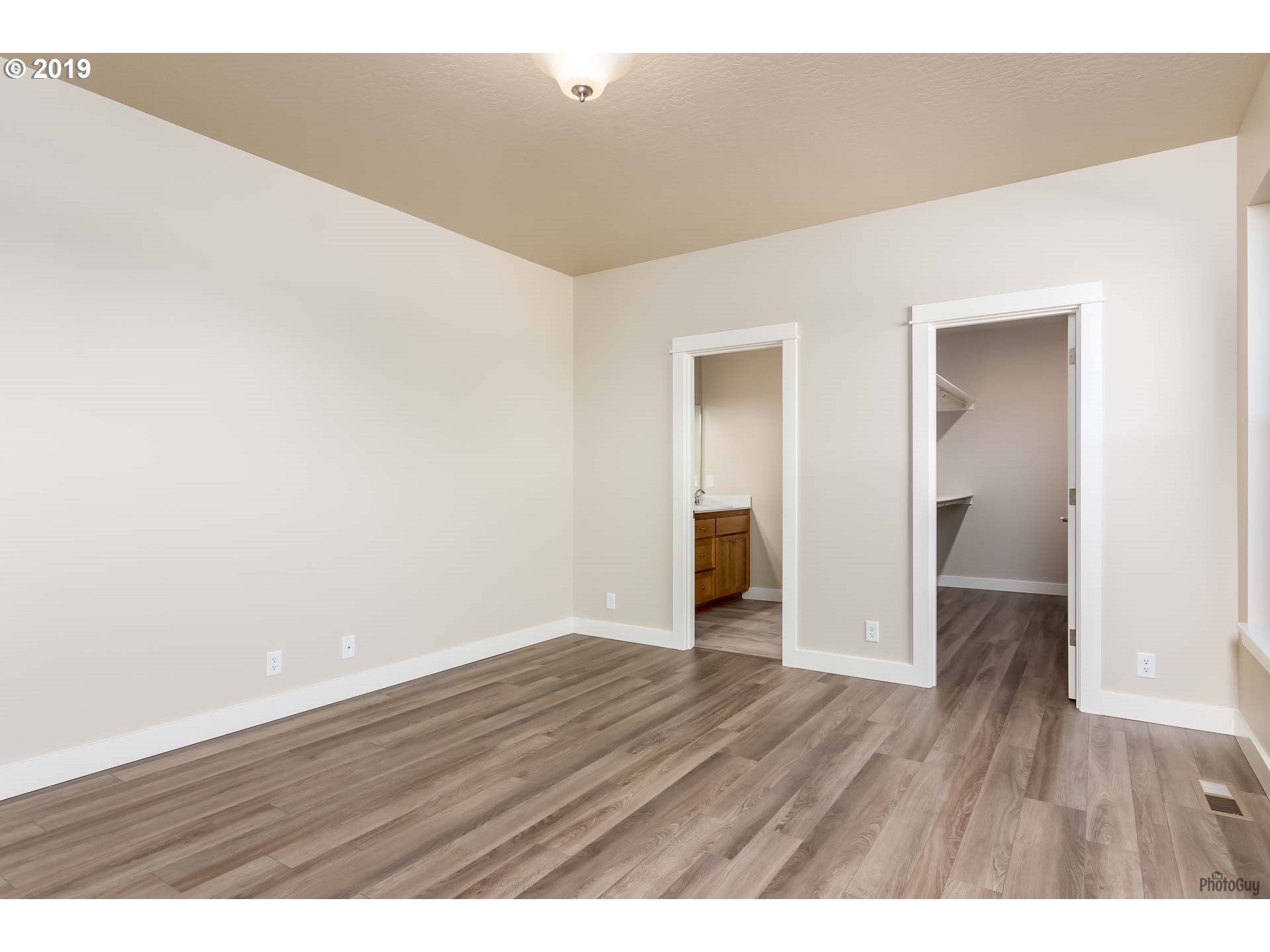 1068 West Olympic Street Springfield, OR 97477 - Photo 20 of 30 a view of an empty room and wooden floor