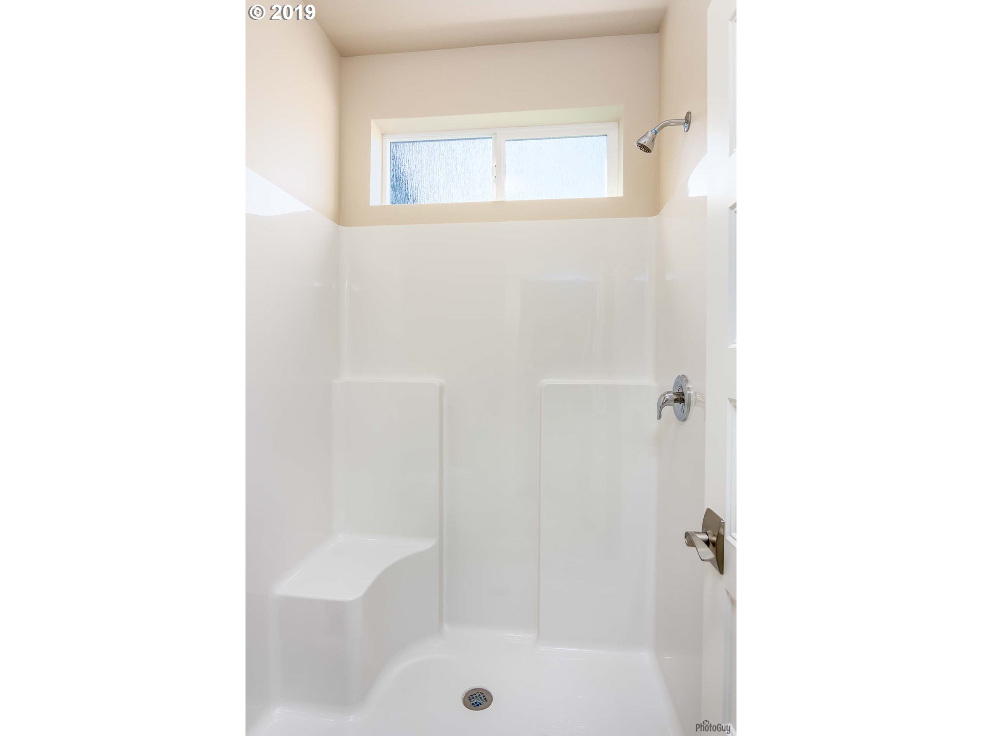 1068 West Olympic Street Springfield, OR 97477 - Photo 24 of 30 a bathroom with a bathtub and a shower