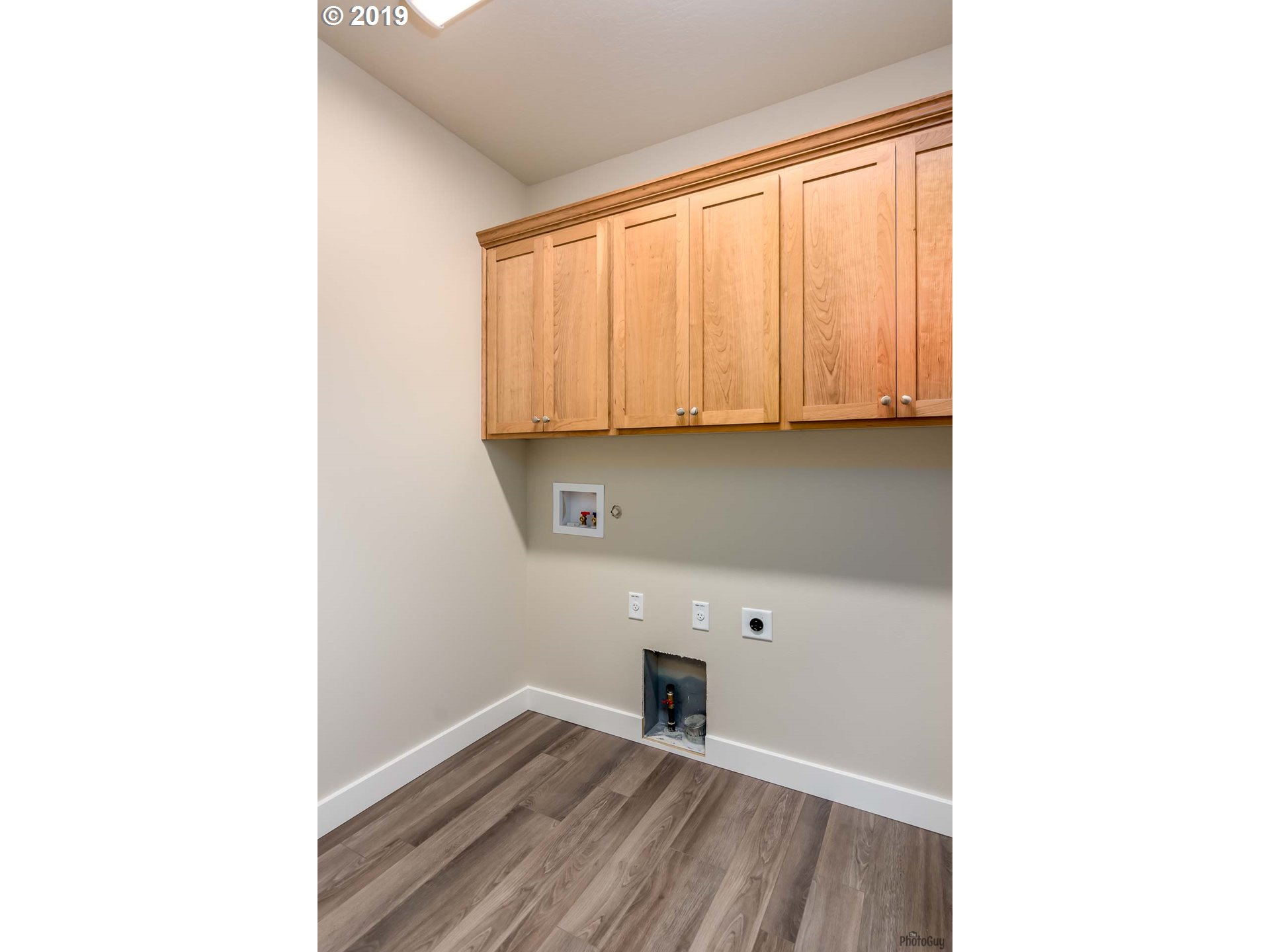 1068 West Olympic Street Springfield, OR 97477 - Photo 26 of 30 a view of a room with wooden floor