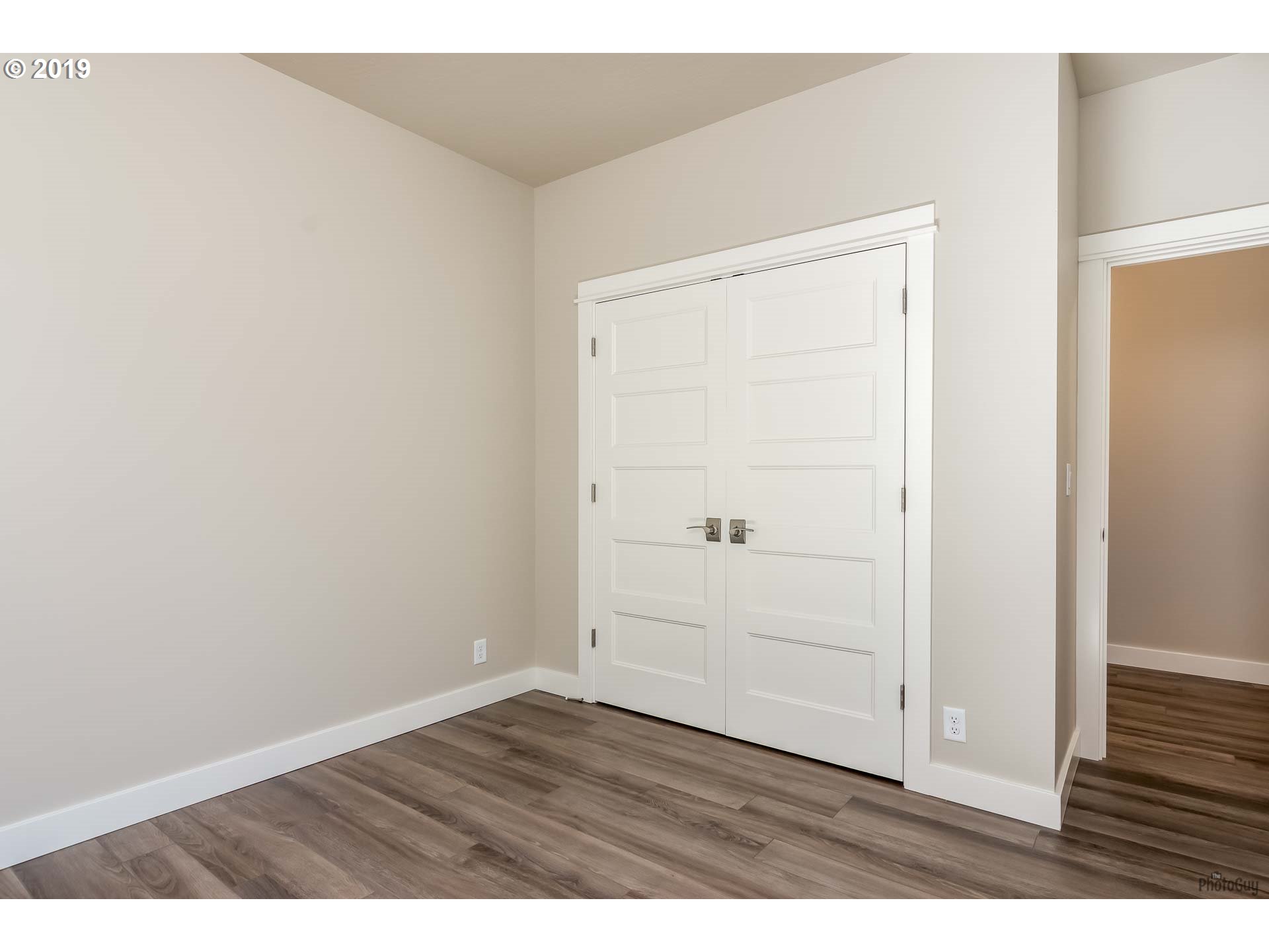 1068 West Olympic Street Springfield, OR 97477 - Photo 28 of 30 an empty room with wooden floor